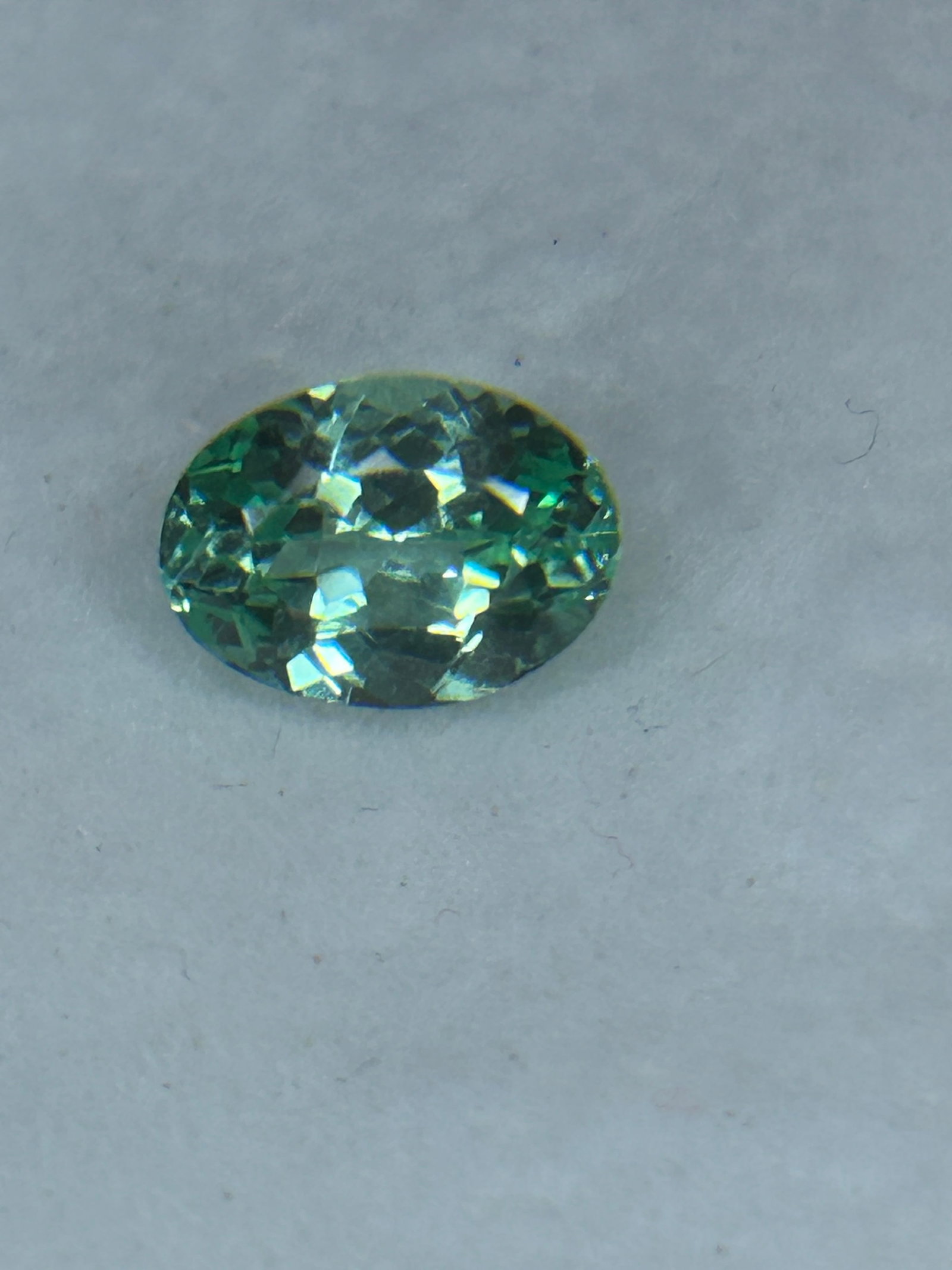 2.90 Carat Natural Montana Green Sapphire Brilliant Oval Cut: Montana green sapphires typically display unique pastel, sage, or minty shades, often with subtle blue, yellow, or teal undertones. They are famous for their pleochroism, meaning they gracefully