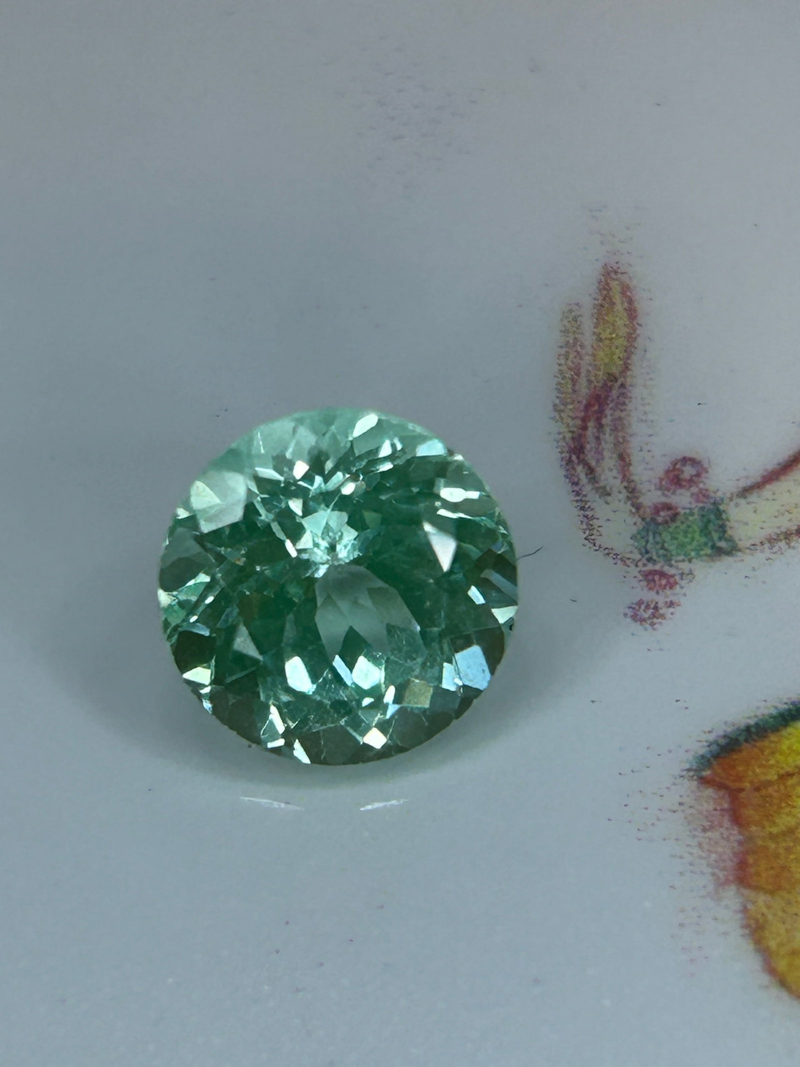 2.70 Carat Natural Mozambique Green Tourmaline Brilliant Round Cut: Brazilian tourmaline is a vibrant, transparent gemstone originating from Brazil, featuring a mixed brilliant cut designed to maximize light reflection and sparkle.