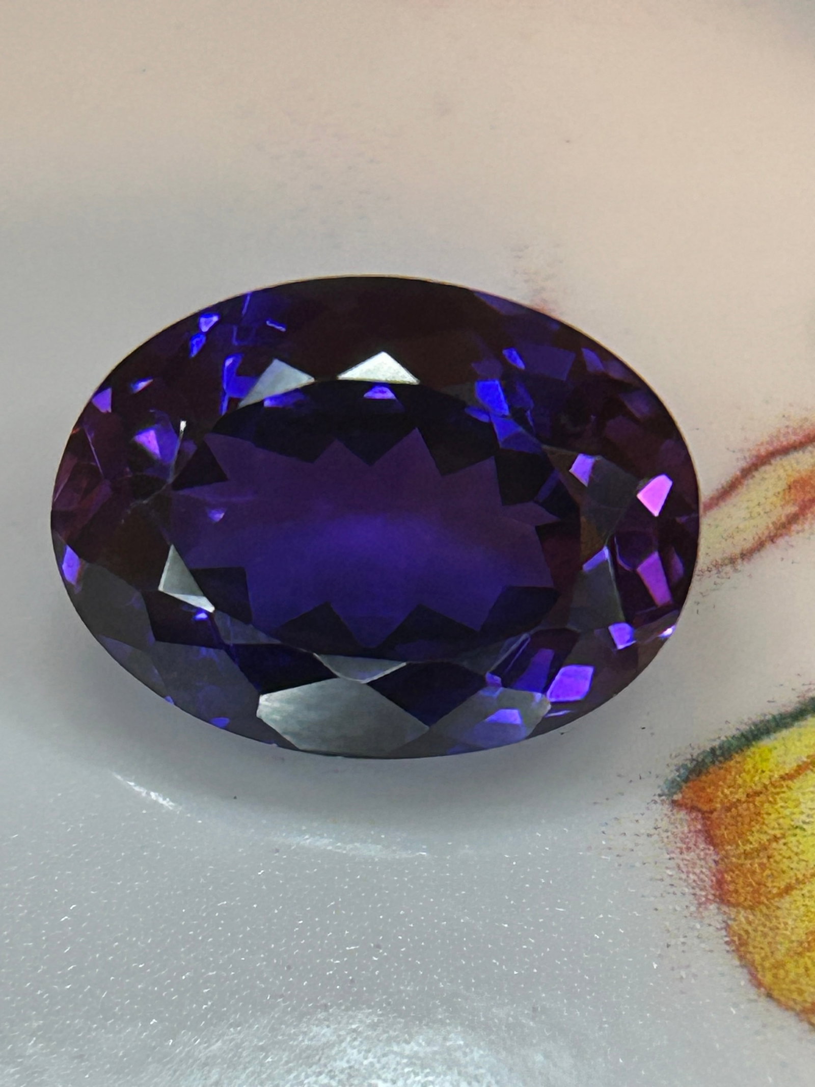 11.75 Carat Natural Montana Purple Sapphire Brilliant Oval Cut: Yogo Gulch deposits. Maximizes weight retention while enhancing sparkle and light return. Boasting an extraordinary, ultra-rare double-digit carat weight for its origin, this investment-grade gem is a