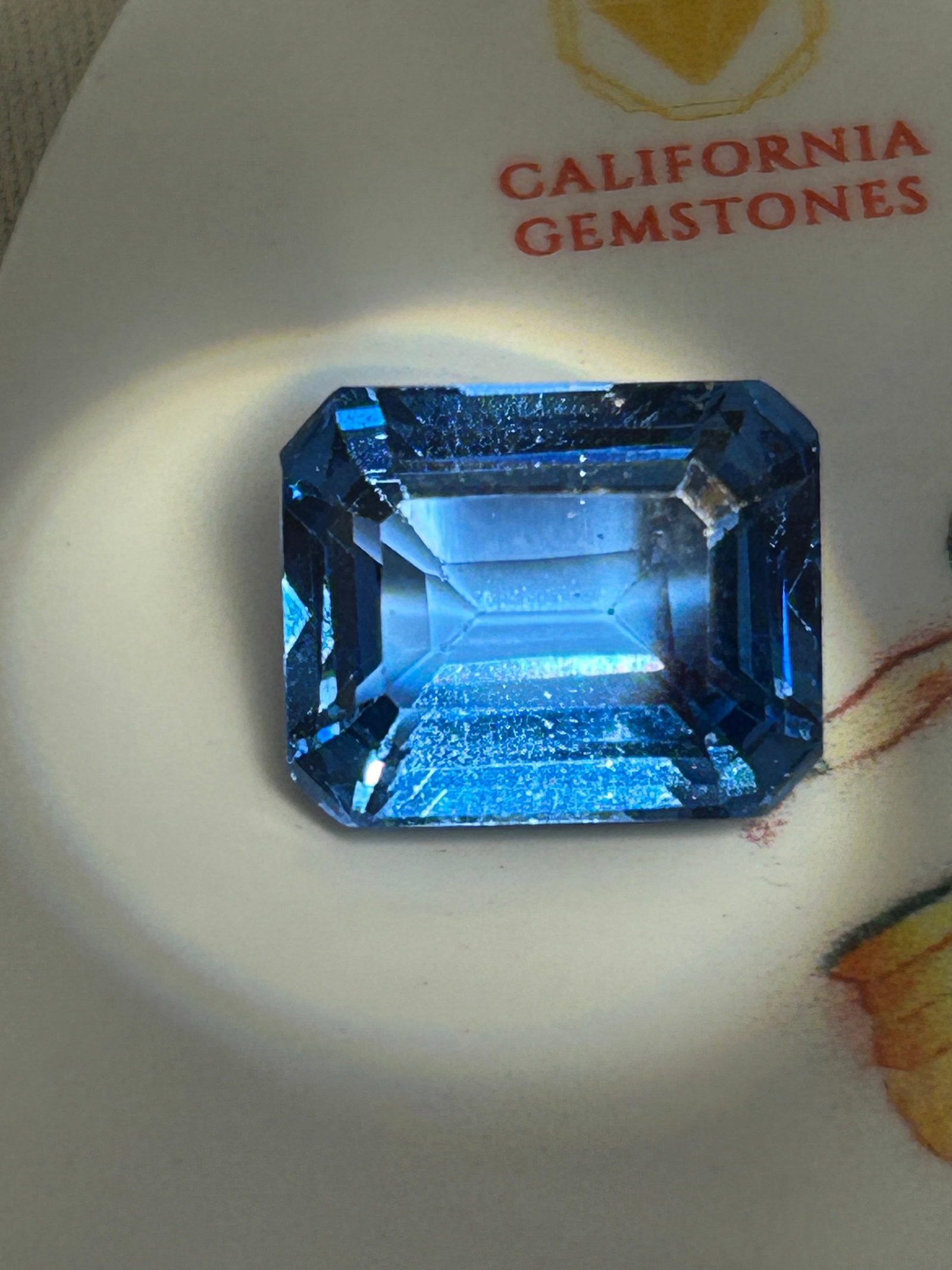 11.20 Carat Natural Brazilian Aquamarine Emerald Step Cut: Classic deep sea-blue hues typical of premium Brazilian deposits. Distinctive "hall of mirrors" effect created by the long, parallel step facets. High clarity and highly collectible.