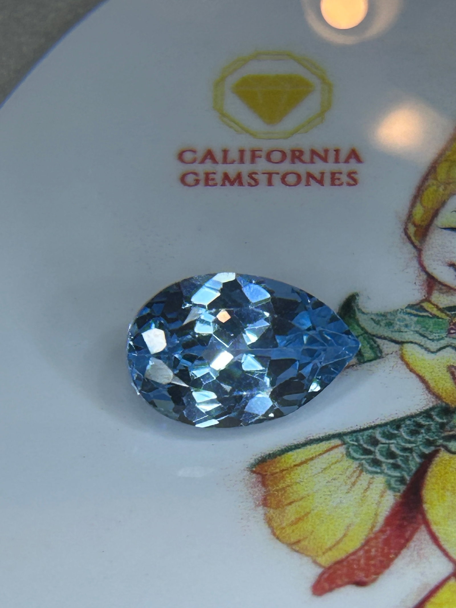7.00 Carat Natural Blue Tourmaline Brilliant Pear Cut: A vibrant gemstone featuring an elegant teardrop shape designed to maximize sparkle and brilliance.