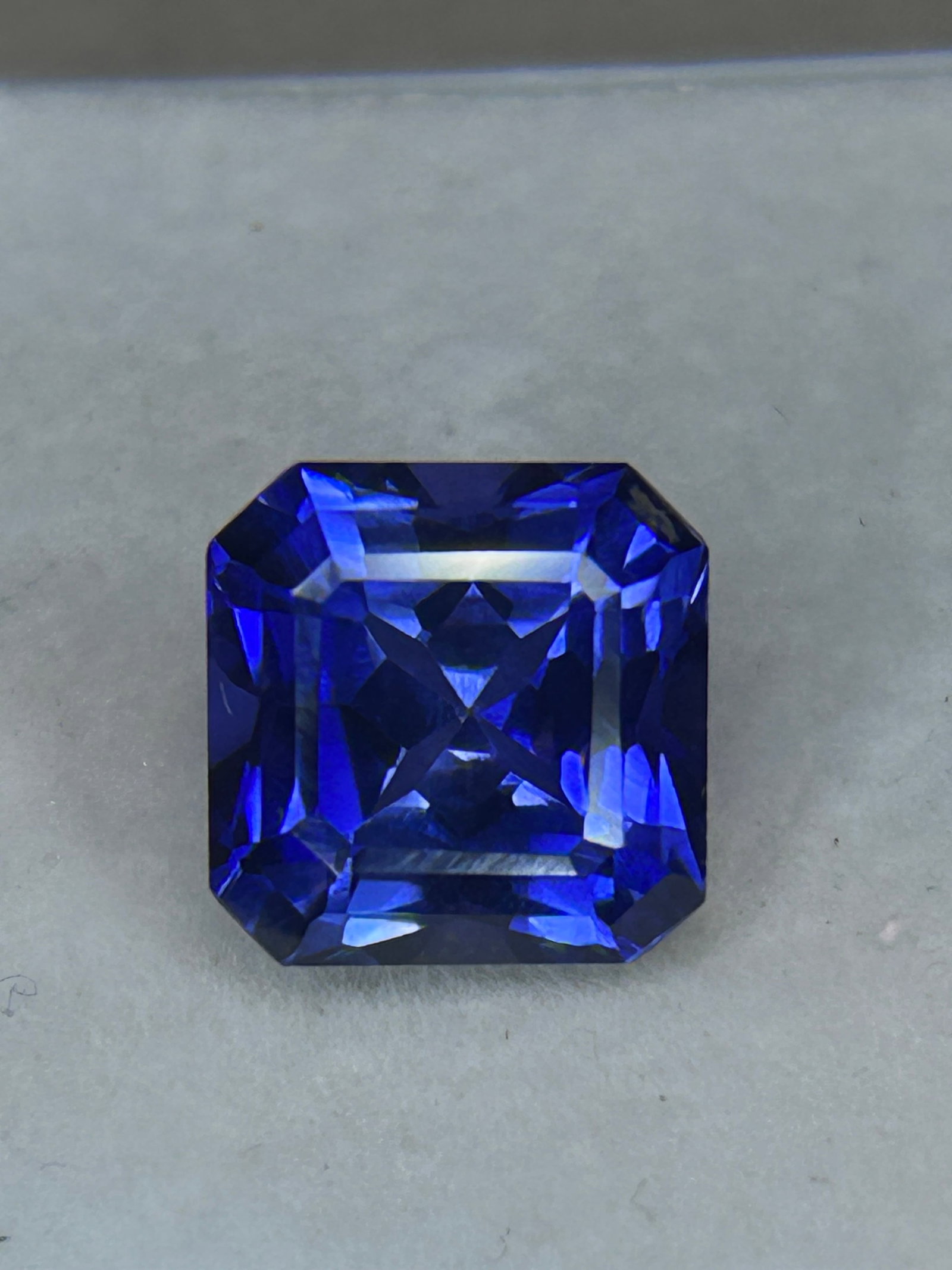 10 Carat --Natural Ceylon Blue Sapphire---Brilliant Asscher Cut: a vivid cornflower to royal blue hue from Sri Lanka (formerly Ceylon), combined with the square step-cut geometry and cropped corners of an Asscher cut that creates a unique "hallway" of reflections.