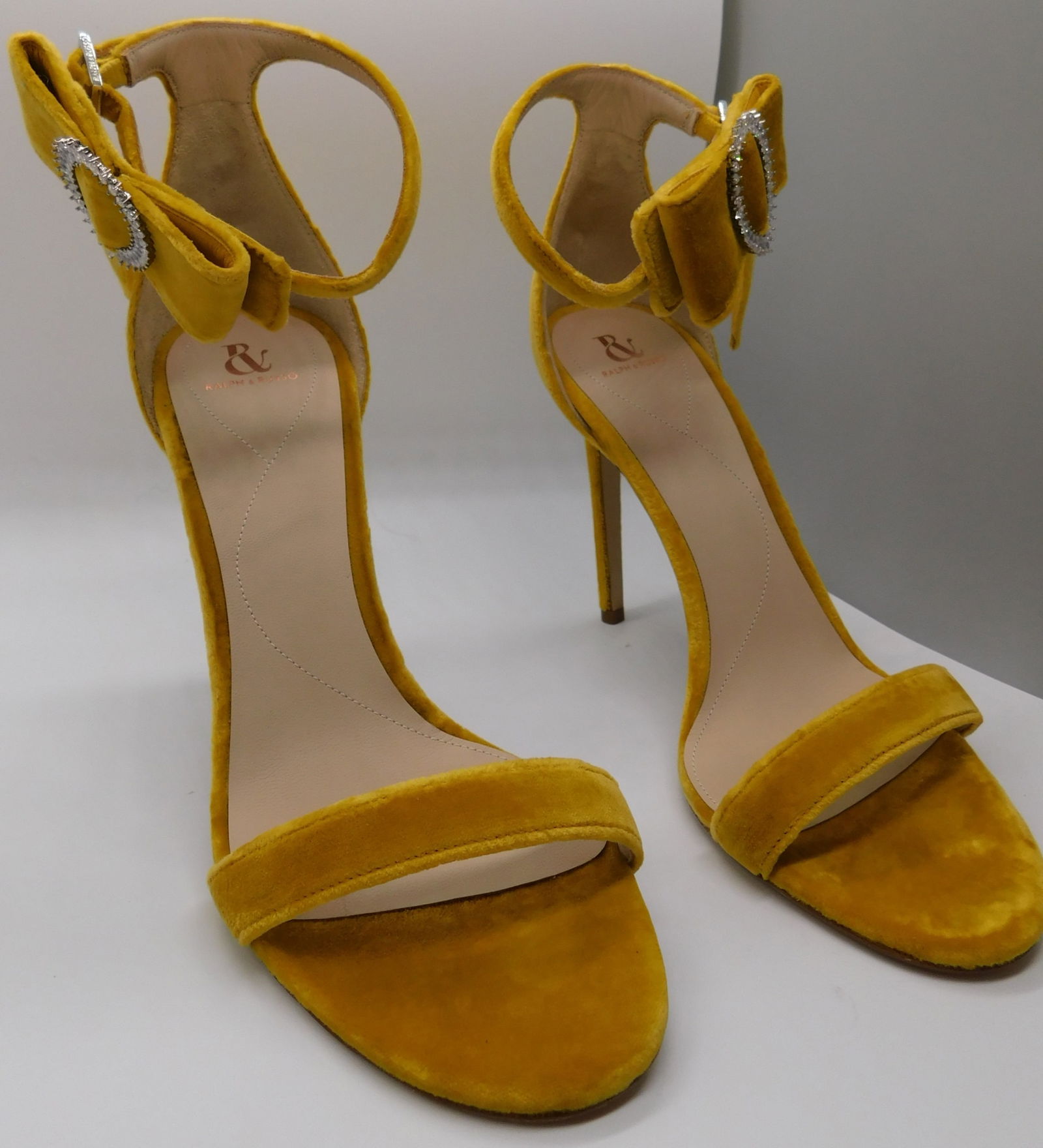 Pair of Ralph & Russo Bow Sandals, Velvet Fabric, Mustard/ Swarovski Buckle, With Box & Dust Bags. E: Pair of Ralph & Russo Bow Sandals, Velvet Fabric, Mustard/ Swarovski Buckle, With Box & Dust Bags. EU Size 36. (RRP £625) Master refined minimalism in th