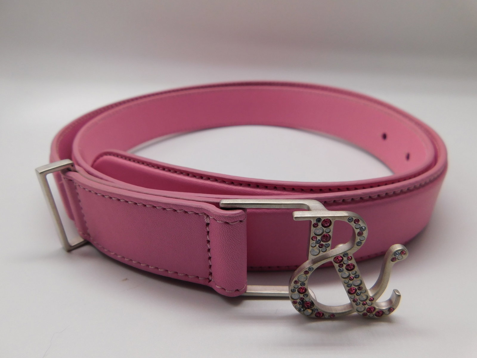 Ralph & Russo Monogram Belt, Calf, Pink/Silver with Crystals, Size L (RRP £350) Thin, pin: Ralph & Russo Monogram Belt, Calf, Pink/Silver with Crystals, Size L (RRP £350) Thin, pink leather belt with R&R monogram buckle in brushed silver encrusted with crystals. Perfect