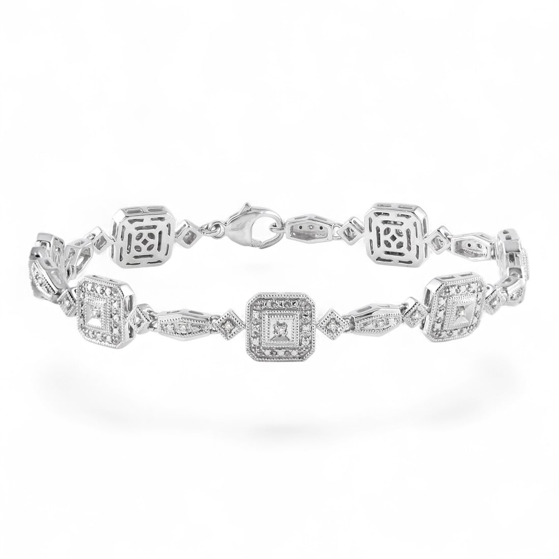 0.15 Ctw Square Shape White Diamond Art Deco Sterling Silver Bracelet - Certified: Rare and radiant, this stunning Square Shape bracelet featuring Natural Diamonds offers a touch of the extraordinary. Showcasing the gems in a Pave arrangement, the bracelet consists of 13.8 grams of