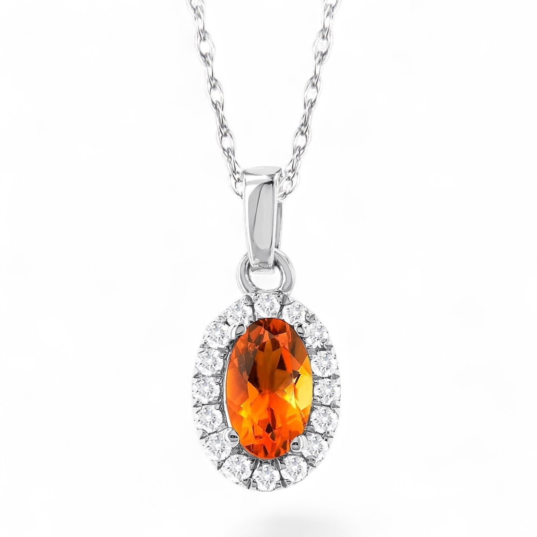 5x3 MM Oval Citrine and 0.07 Ctw Halo White Diamond Modern 10K White Gold Pendant - Certified: A vision of luxury, this stunning Halo pendant featuring Natural Diamonds and Citrine defines sophistication. Expertly mounted in a Halo setting, the pendant is crafted in 0.35 grams of solid 10K Whit