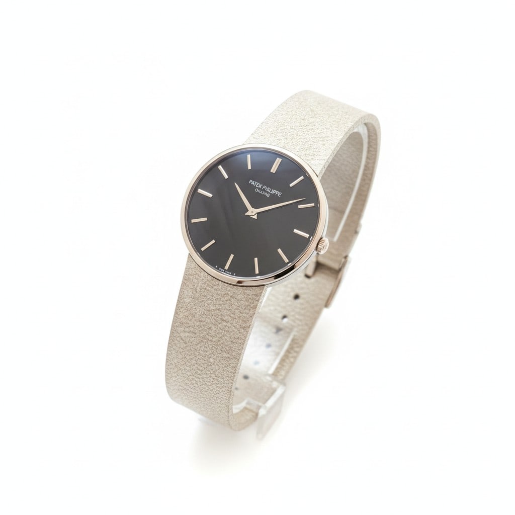 Patek Philippe Vintage Calatrava 3618/1 18k White Gold 1970s Manual Wind 33mm Gents Watch: This rare Patek Philippe Vintage Calatrava, reference 3618/1, is a masterful example of 1970s luxury horology. Crafted from solid 18k white gold, the 33mm case features a distinctive etched bezel that