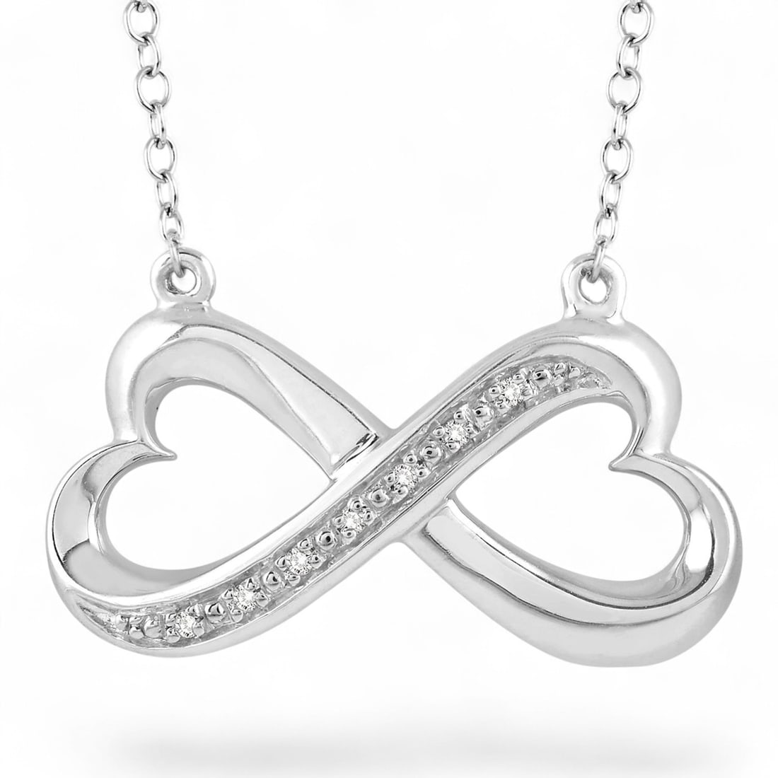 0.03 Ctw Heart Infinity White Diamond Modern Sterling Silver Pendant - Certified: Defining modern elegance, this stunning Heart Infinity pendant featuring Natural Diamonds captures the essence of style. Securely held in a classic Pave design, the pendant is forged from 1.8 grams of