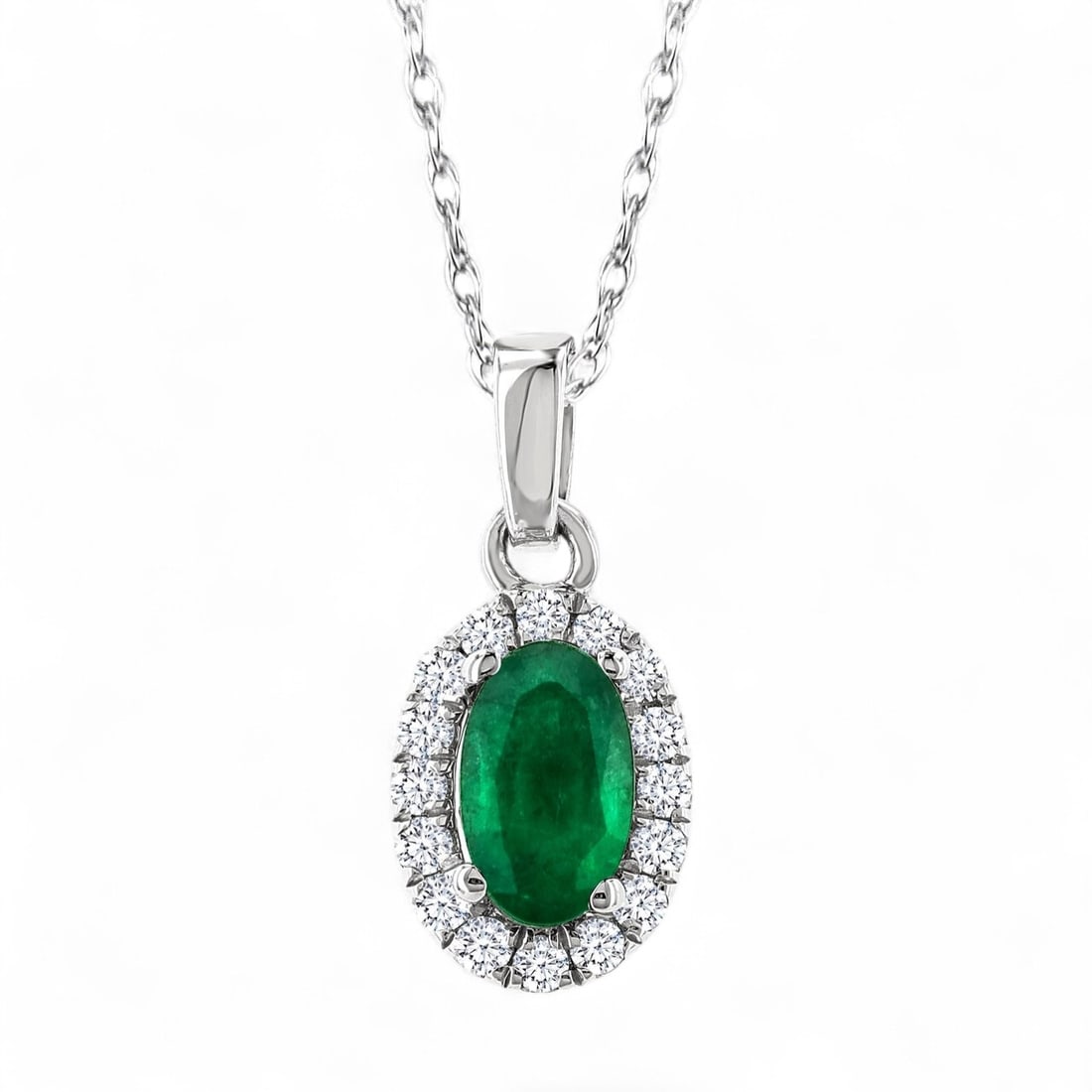 5x3 MM Oval Emerald and 0.07 Ctw Halo Precious White Diamond Modern 14K White Gold Pendant -: A symphony of light and color, this stunning Halo Precious pendant featuring Natural Diamonds and Emeralds embodies the pinnacle of luxury. The gemstones are nestled within a Halo framework, supported