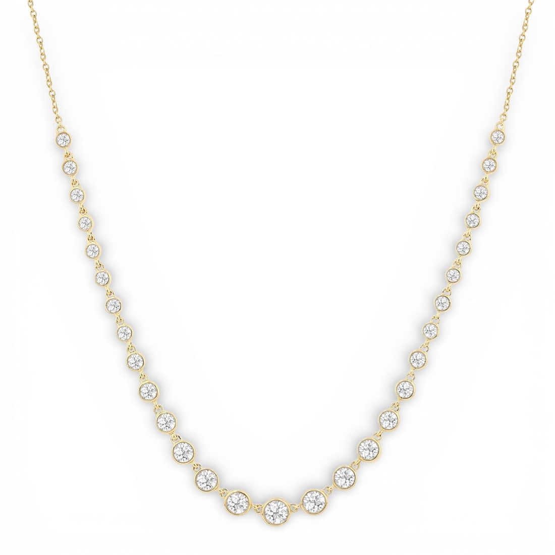 1.28 ctw Graduated Bezel Set Diamond Tennis 14K Yellow Gold Necklace: A symphony of light and color, this exquisite Graduated Bezel Set necklace featuring White Diamond embodies the pinnacle of luxury. The gemstones are nestled within a Bezel framework, supported by a s