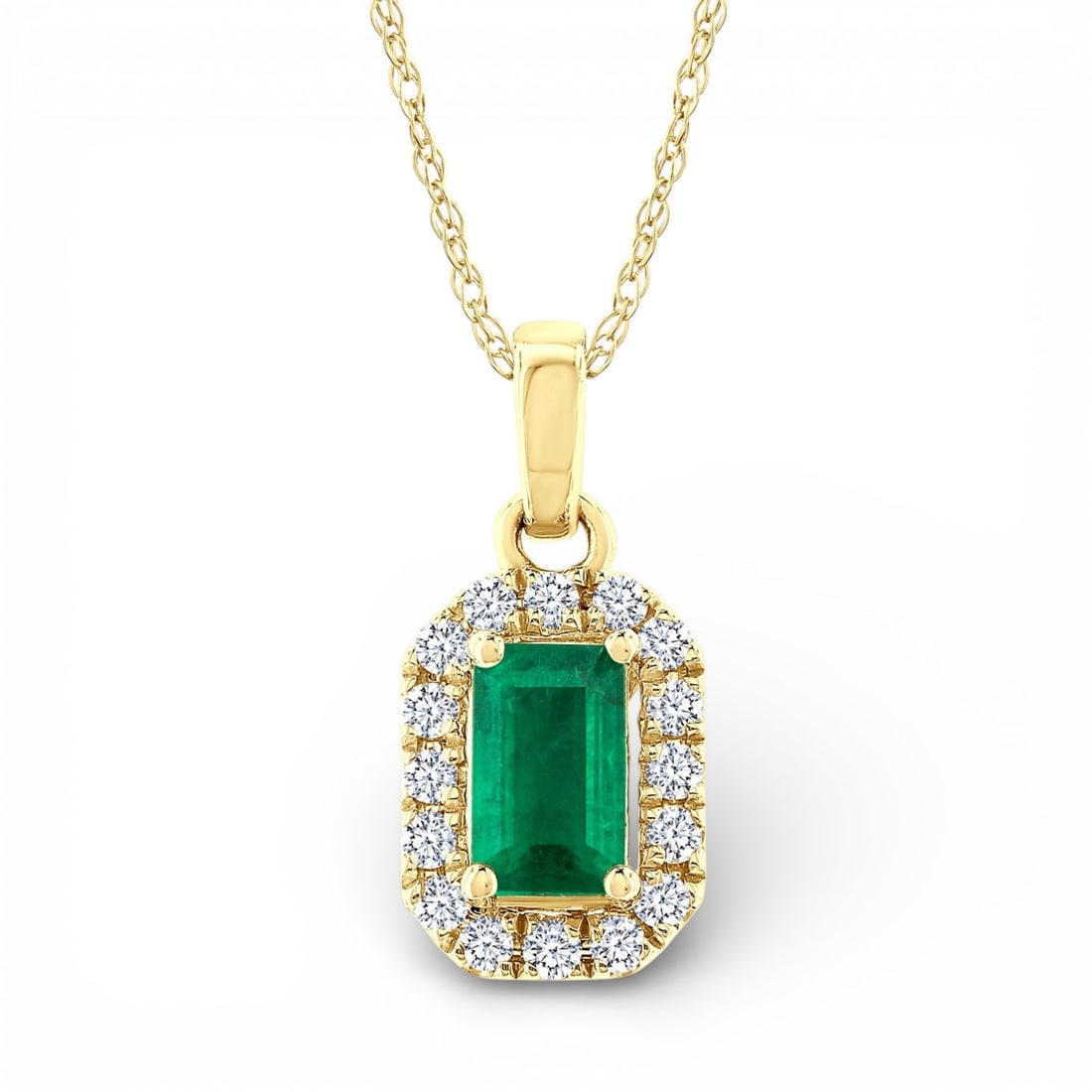 5x3mm Emerald and 0.07 ctw Diamond 10K Yellow Gold Pendant: A testament to superior craftsmanship, this elegant Halo pendant featuring Emerald, White Diamond is unparalleled. Crafted with precision, the Halo setting is seamlessly integrated into 0.35 grams of