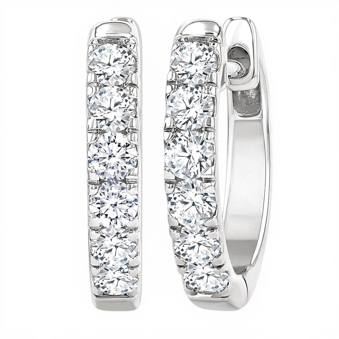 0.5ctw White Diamond 14K White Gold Hoop Earrings: A testament to superior craftsmanship, this elegant Line Setting Hoop pair of earrings featuring White Diamond is unparalleled. A detailed Line gallery secures the stones, rendered in 2.35 g of lustro