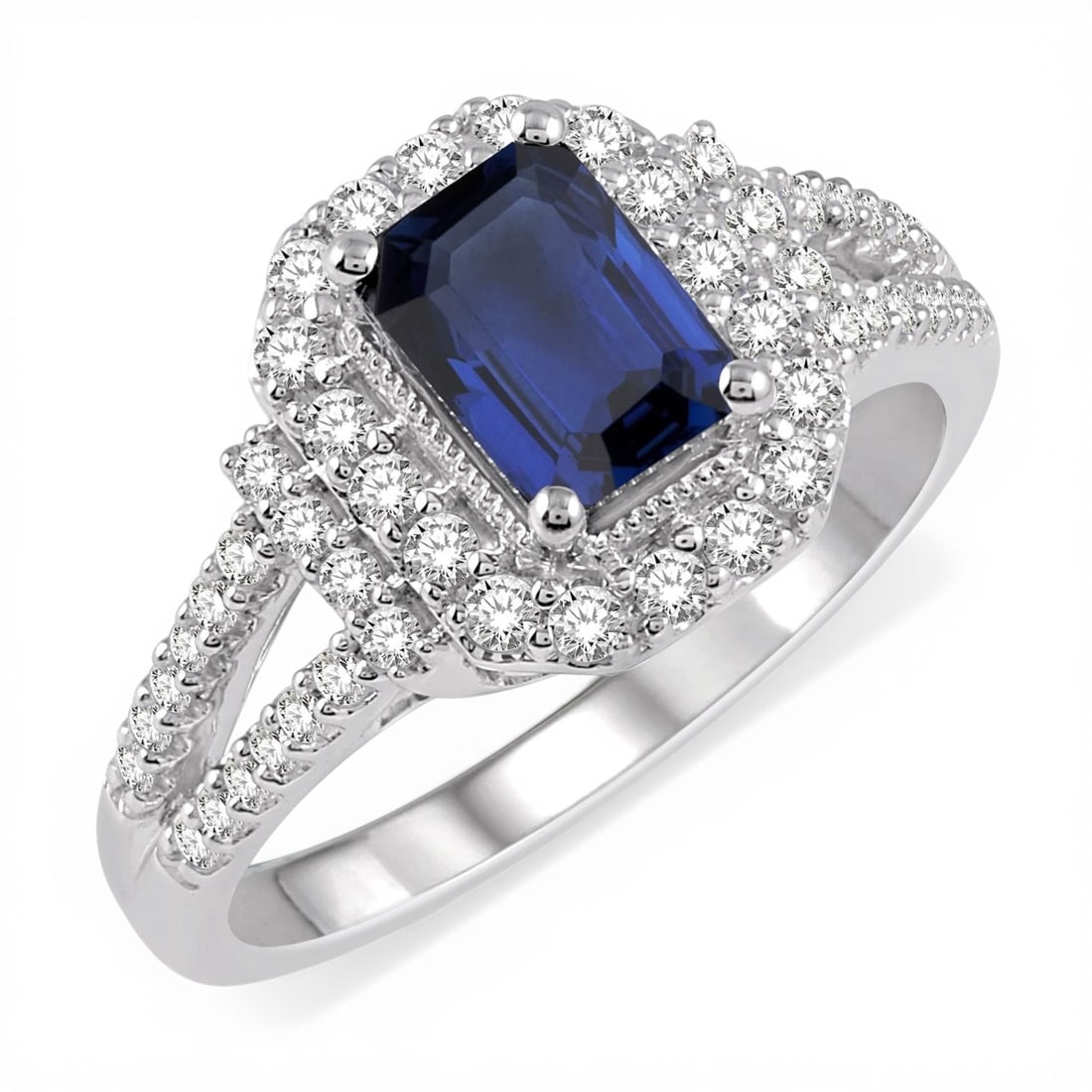 7x5mm Blue Sapphire and 0.51ctw Diamond 14K White Gold Ring: Timeless and sophisticated, this magnificent Emerald Shape ring featuring Blue Sapphire, White Diamond radiates enduring beauty. Expertly mounted in a Halo setting, the ring is crafted in 6.0 grams of