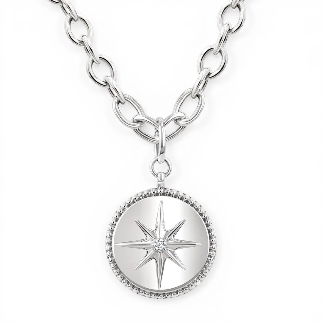 0.05ctw Round Diamond Compass Medallion Sterling Silver Pendant: Exuding opulence and grace, this elegant Compass Medallion pendant featuring White Diamond is crafted for the distinguished. Showcasing the gems in a Solitaire arrangement, the pendant consists of 7.2