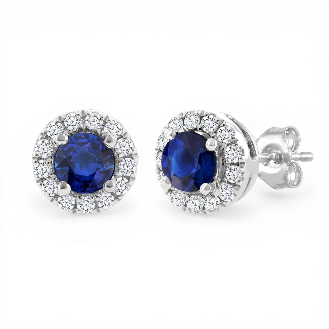 3.25mm Blue Sapphire and 0.12ctw Diamond 10K White Gold Stud Earrings: A symphony of light and color, this stunning Halo pair of earrings featuring Blue Sapphire, White Diamond embodies the pinnacle of luxury. Expertly mounted in a Halo setting, the earrings are crafted