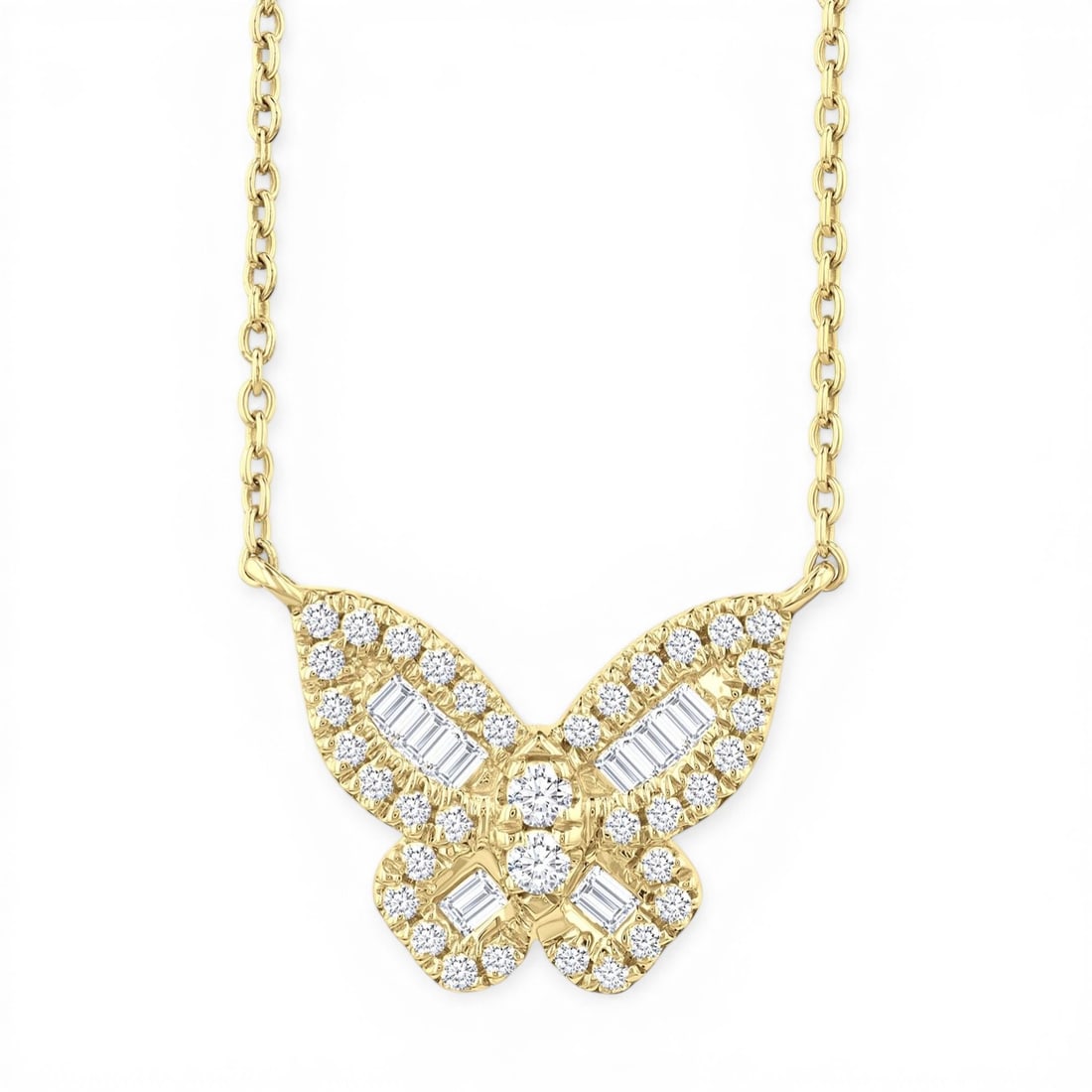 0.28ctw Baguette & Round Diamond Butterfly 10K Yellow Gold Pendant: An exquisite masterpiece of haute joaillerie, this stunning Butterfly pendant featuring White Diamond is a true treasure. Showcasing the gems in a Cluster arrangement, the pendant consists of 0.9 gram