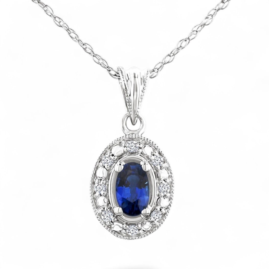 5x3 MM Blue Sapphireand 0.05 Ctw Oval Shape White Diamond Modern 14K White Gold Pendant - Certified: Defining modern elegance, this magnificent Oval Shape pendant featuring Natural Diamonds and Sapphires captures the essence of style. Expertly mounted in a Halo setting, the pendant is crafted in 1.35