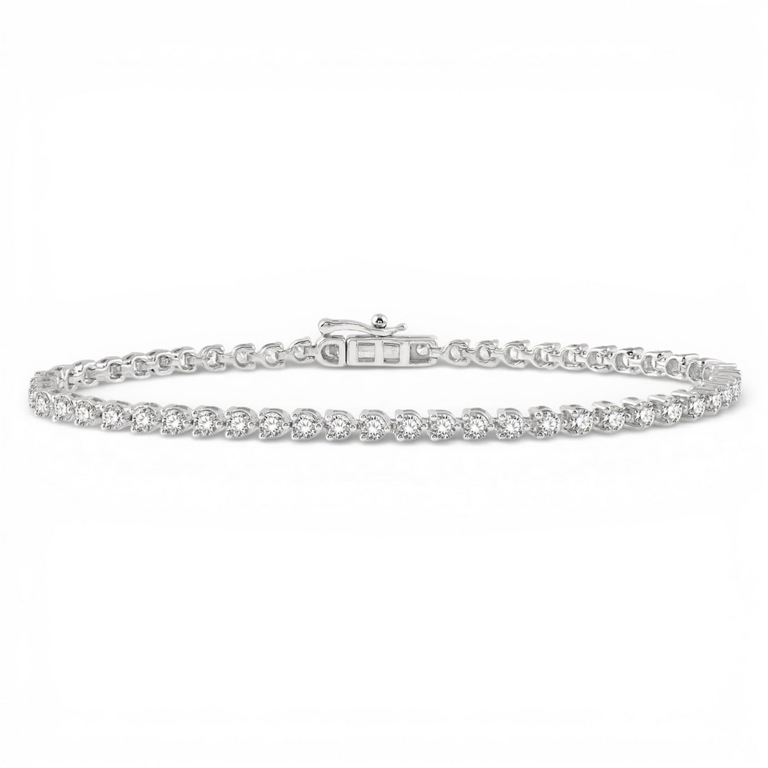 3.03 ctw Round Cut Diamond Tri-Prong 14K White Gold Tennis Bracelet: A vision of luxury, this magnificent Tri-Prong bracelet featuring White Diamond defines sophistication. The gemstones are nestled within a Tri-Prong framework, supported by a substantial 7.6 grams 14K