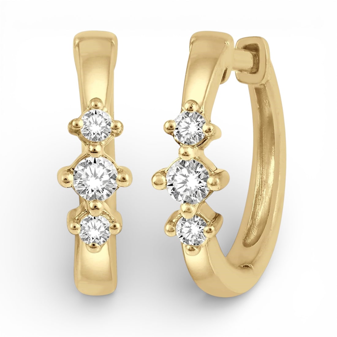 Petite Three Stone 0.15 ctw Diamond 10K Yellow Gold Huggie Earrings: A testament to superior craftsmanship, this elegant Three Stone pair of earrings featuring Natural Diamonds is unparalleled. Showcasing the gems in a Huggie Hoop arrangement, the earrings consist of 1