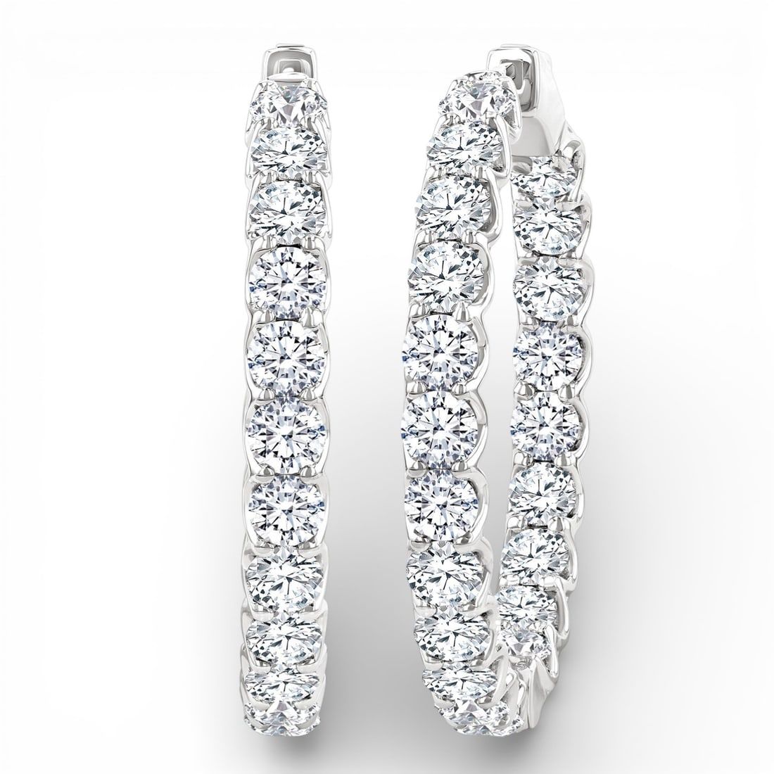 7.98 ctw White Diamond Inside-Out Hoop 14K White Gold Earrings: A testament to superior craftsmanship, this breathtaking Inside-Out Hoop pair of earrings featuring White Diamond is unparalleled. A detailed Continuous Line gallery secures the stones, rendered in 13