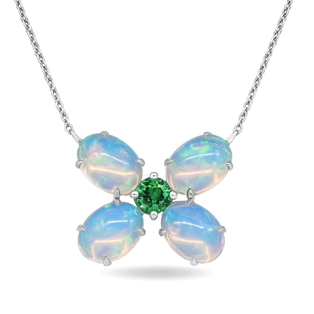 3.32ct Oval Opal and 0.32ct Emerald 14K White Gold Butterfly Pendant: A symphony of light and color, this exquisite Butterfly pendant featuring Opal, Emerald embodies the pinnacle of luxury. The gemstones are nestled within a Cluster framework, supported by a substantia