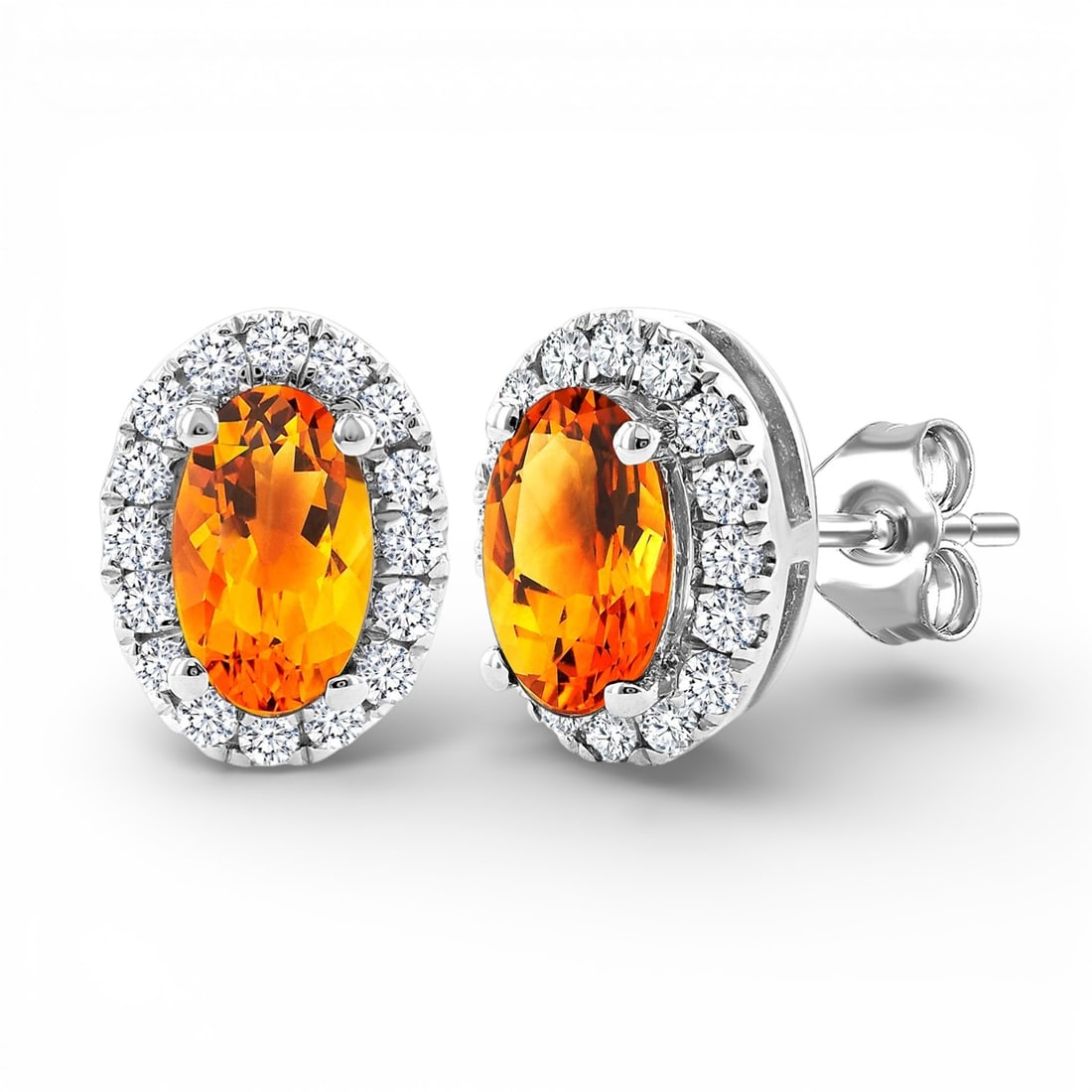 5x3mm Citrine and 0.14 ctw Diamond 10K White Gold Stud Earrings: An exquisite masterpiece of haute joaillerie, this exquisite Halo pair of earrings featuring Citrine, White Diamond is a true treasure. Showcasing the gems in a Halo arrangement, the earrings consists