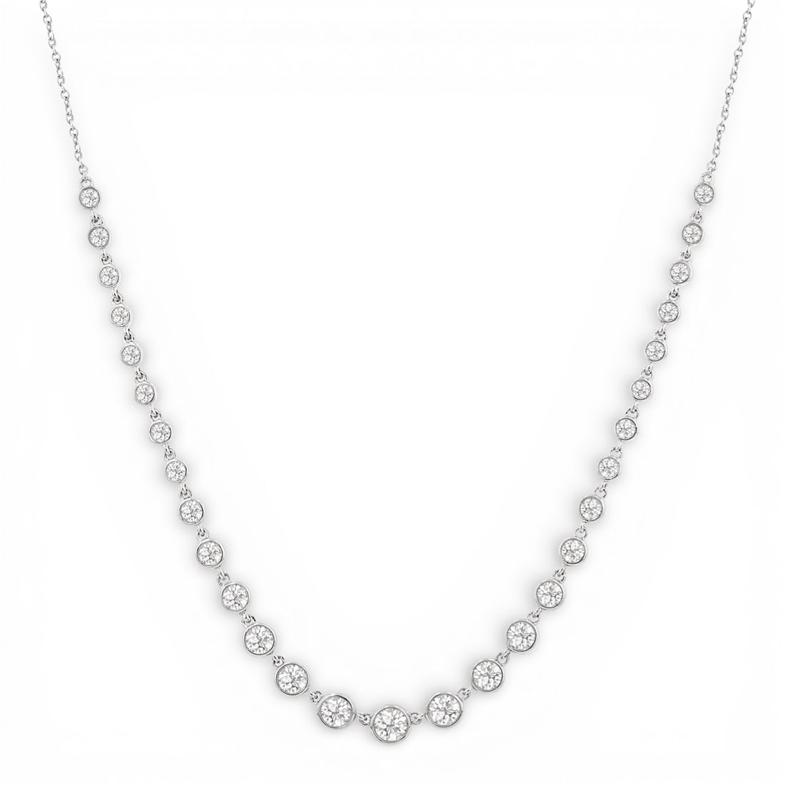 1.28 ctw Graduated Bezel Set Diamond Tennis Necklace 14K White Gold: A testament to superior craftsmanship, this stunning Bezel Set Tennis necklace featuring White Diamond is unparalleled. Crafted with precision, the Bezel Set Tennis setting is seamlessly integrated in