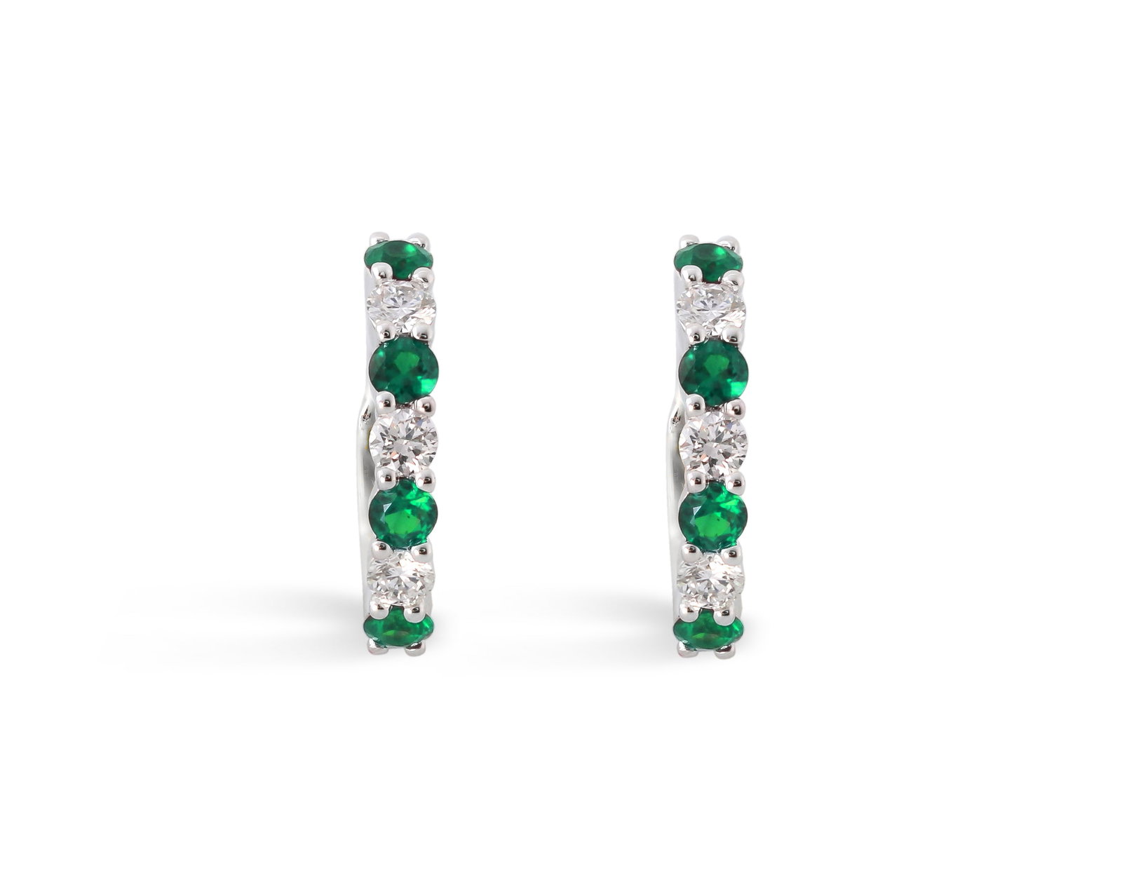 0.96ctw Emerald and 0.38ct White Diamond 14K White Gold Huggies Earrings: Rare and radiant, this elegant Hoop pair of earrings featuring Emerald, White Diamond offers a touch of the extraordinary. A detailed Hoop gallery secures the stones, rendered in 1.99 grams of lustrou
