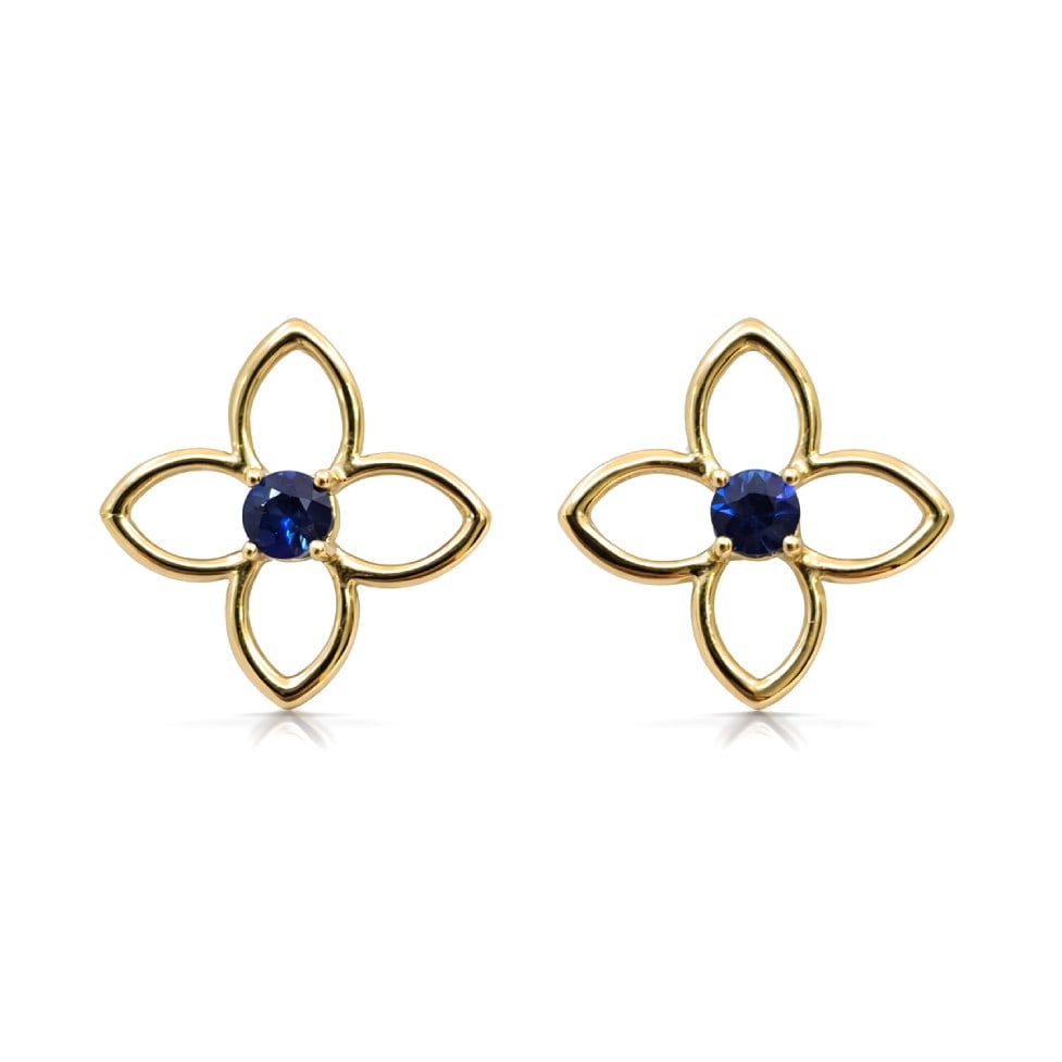 0.53ctw Sapphire Clover 14K Yellow Gold Stud Earrings: A vision of luxury, this elegant Clover pair of earrings featuring Blue Sapphire defines sophistication. The gemstones are nestled within a Bezel framework, supported by a substantial 2.63 grams 14K Y