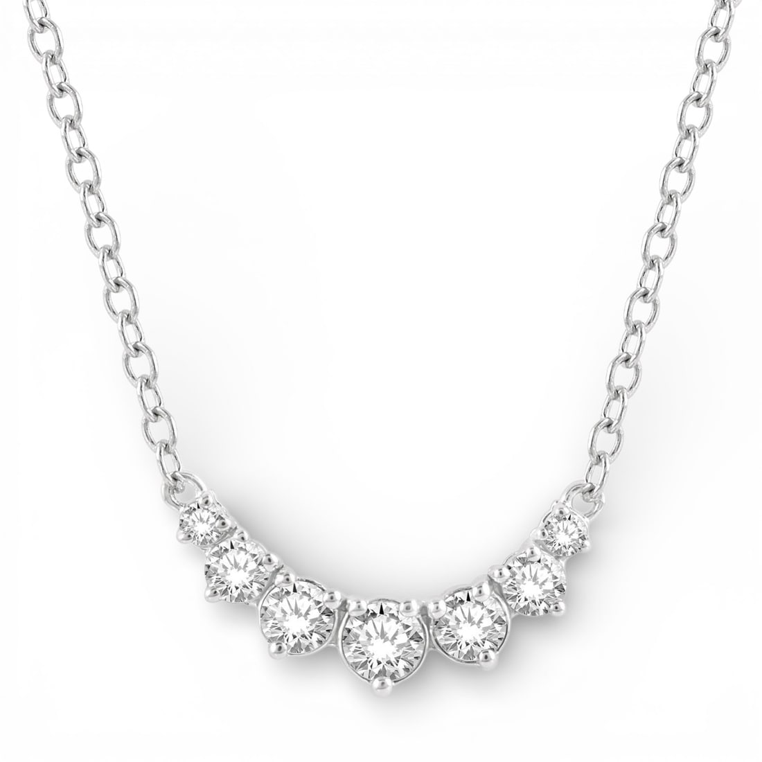 0.25 ctw Graduated Diamond Smile 14K White Gold Necklace: Defining modern elegance, this elegant Smile Necklace featuring White Diamond captures the essence of style. Securely held in a classic Cluster design, the necklace is forged from 0.9 grams of high-po