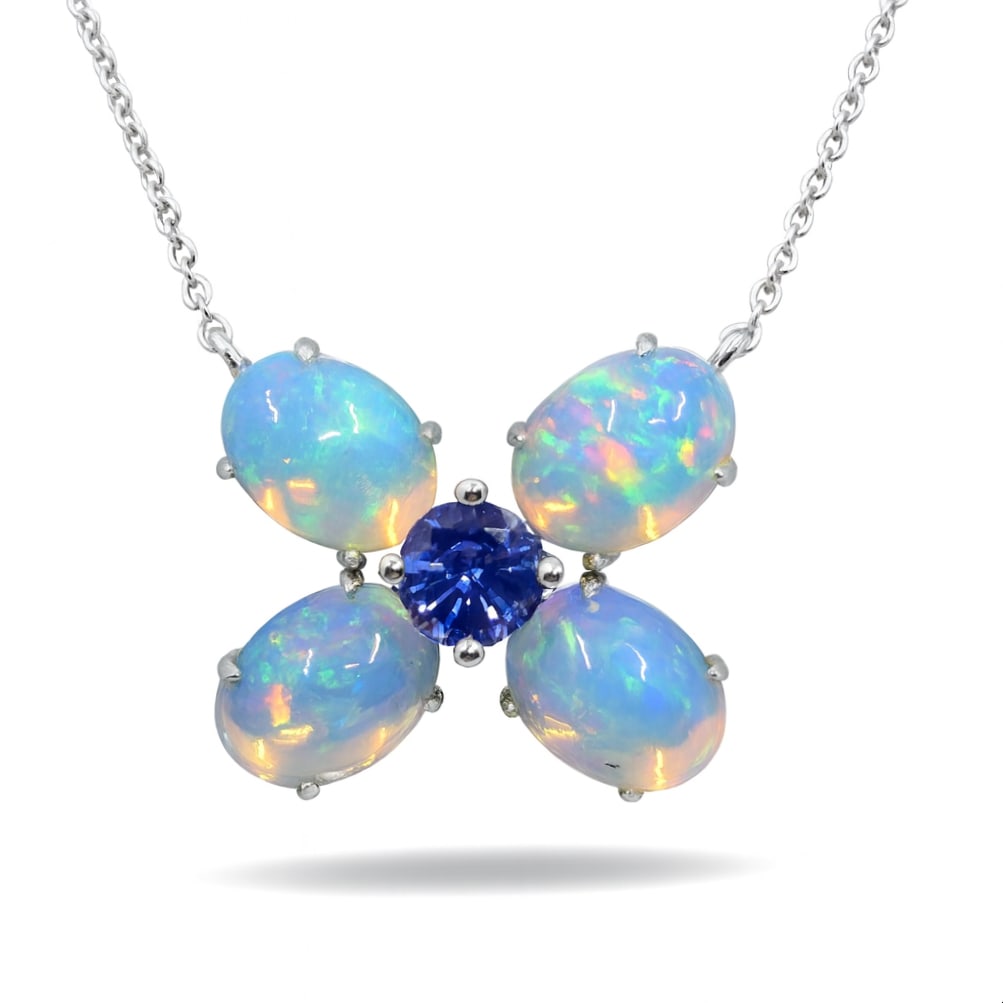 3.59ctw Opal and 0.51ct Blue Sapphire 14K White Gold Pendant: A testament to superior craftsmanship, this exquisite Butterfly pendant featuring Opal, Blue Sapphire is unparalleled. A detailed Cluster gallery secures the stones, rendered in 3.72 grams of lustrous