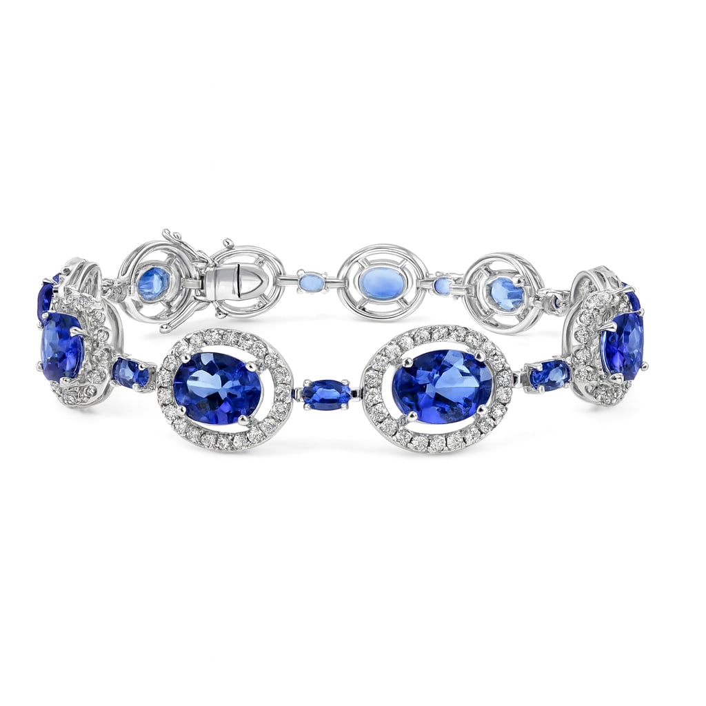 20.9ctw Tanzanite and 3.26ctw Diamond 18K White Gold Bracelet: Epitomizing grandeur, this magnificent Halo bracelet featuring Tanzanite, White Diamond stands as a beacon of refined taste. Crafted with precision, the Halo setting is seamlessly integrated into 18.2