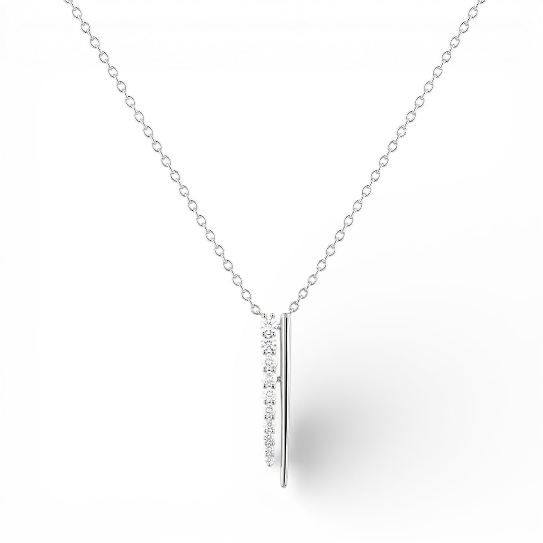 0.49 ctw Diamond Line & Bar 18K White Gold Pendant Necklace: Rare and radiant, this stunning Line & Bar pendant necklace featuring White Diamond offers a touch of the extraordinary. Showcasing the gems in a Line arrangement, the pendant necklace consists of 2.1