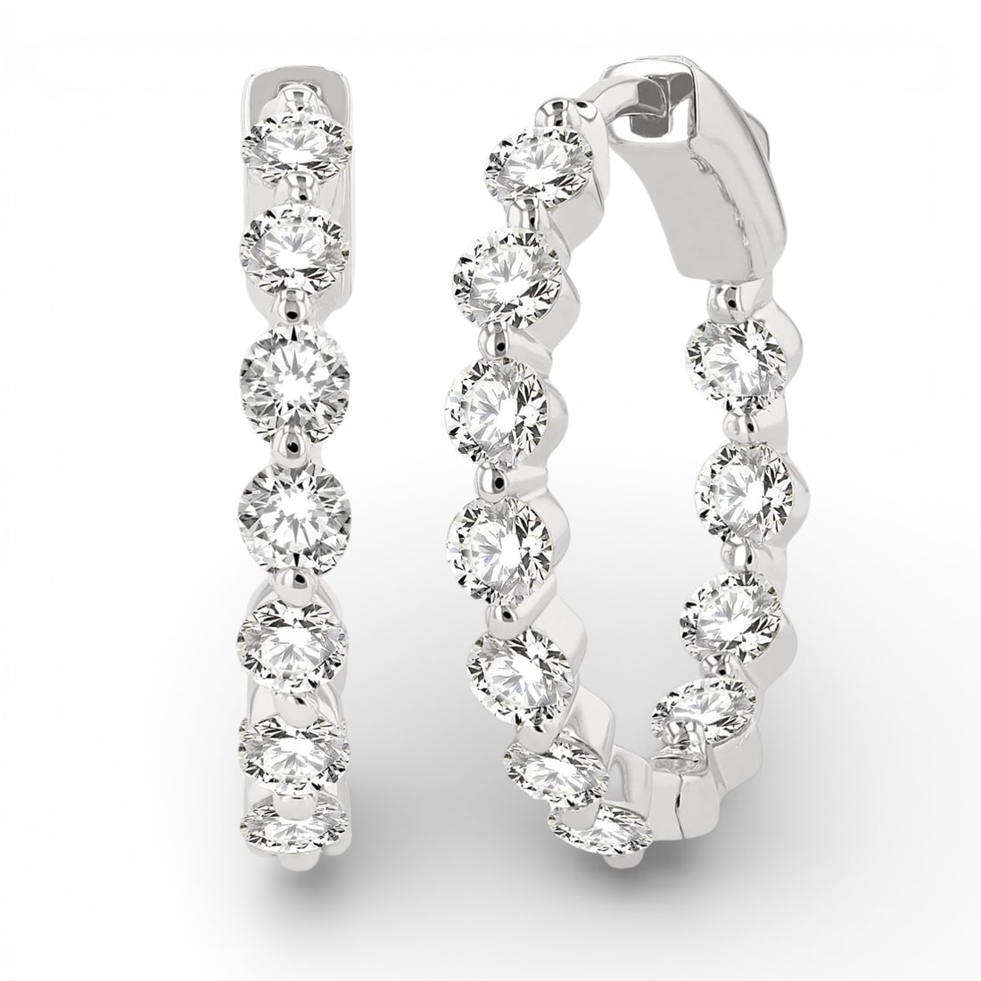 2.04 ctw Diamond Inside-Out 14K White Gold Hoop Earrings: An exquisite masterpiece of haute joaillerie, this breathtaking Inside-Out pair of earrings featuring Natural Diamonds is a true treasure. Showcasing the gems in a Shared Prong arrangement, the earrin