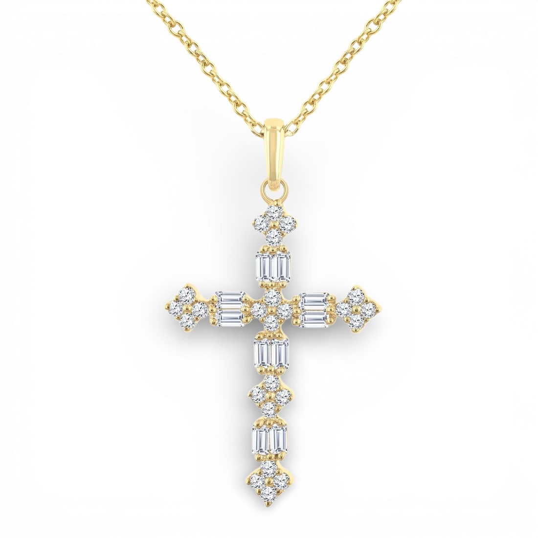 0.31 ctw Baguette & Round Diamond Floral Cross 14K Yellow Gold Pendant: An exquisite masterpiece of haute joaillerie, this breathtaking Floral Cross pendant featuring White Diamond is a true treasure. Crafted with precision, the Cluster setting is seamlessly integrated in