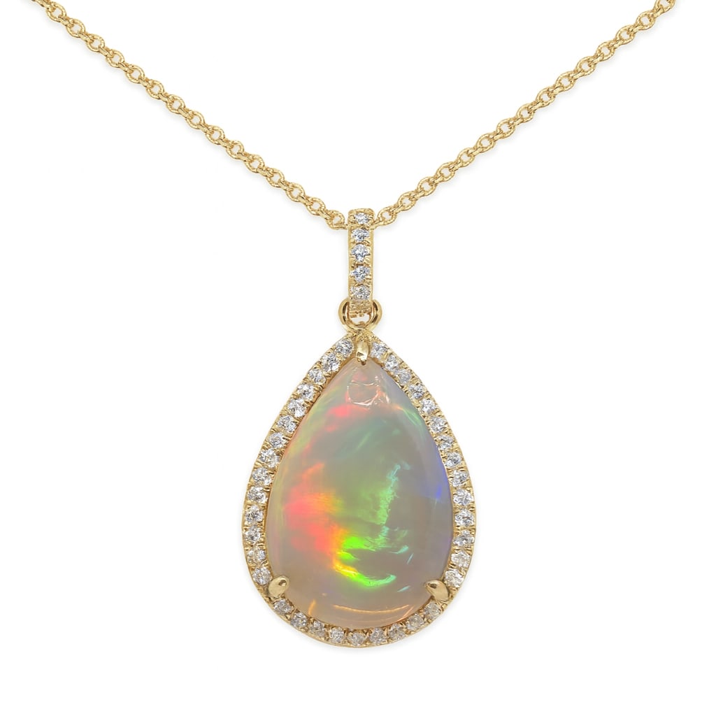 2.50ct Opal and 0.20ctw Diamond 14K Yellow Gold Pendant: Defining modern elegance, this stunning Halo pendant featuring Opal, White Diamond captures the essence of style. Securely held in a classic Halo design, the pendant is forged from 3.32 grams of high-
