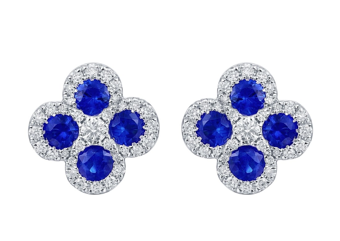 1.13ctw Sapphire Diamond 14k White Gold Clover Stud Earrings: Timeless and sophisticated, this exquisite Clover pair of earrings featuring Blue Sapphire, White Diamond radiates enduring beauty. The gemstones are nestled within a Cluster framework, supported by a