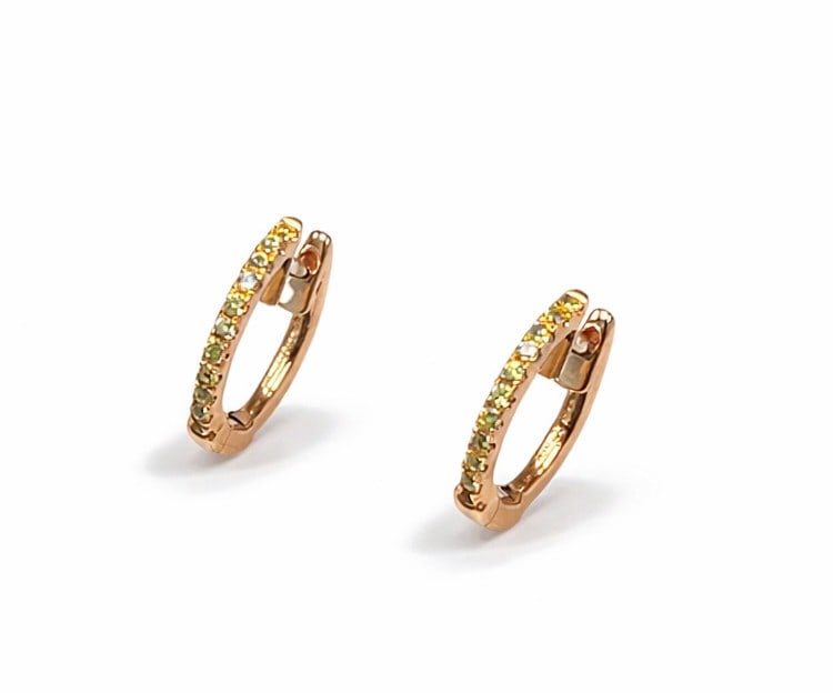 0.20ctw Yellow Sapphire 14K Yellow Gold Huggie Earrings: A symphony of light and color, this stunning Huggies pair of earrings featuring Yellow Sapphire embodies the pinnacle of luxury. The gemstones are nestled within a Pave framework, supported by a subst