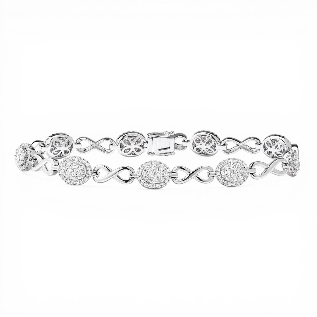 2.25 ctw Diamond Fiori Infinity 18K White Gold Link Bracelet: Captured in a moment of brilliance, this breathtaking Fiori Oval And Infinity Alternating bracelet featuring White Diamond speaks to the connoisseur. The gemstones are nestled within a Cluster framewo