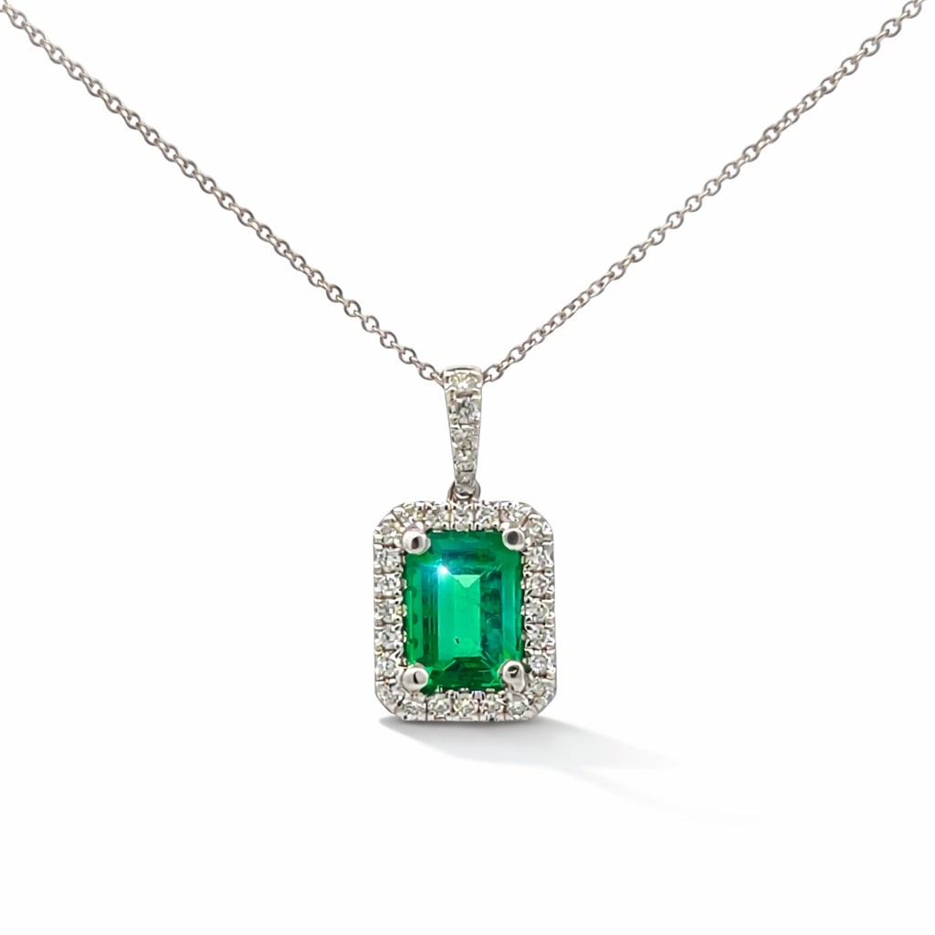 2.10ct Colombian Emerald E/C and 0.12ctw Diamond 18K White Gold Pendant: Defining modern elegance, this breathtaking Halo necklace featuring Emerald, White Diamond captures the essence of style. The gemstones are nestled within a Halo framework, supported by a substantial 