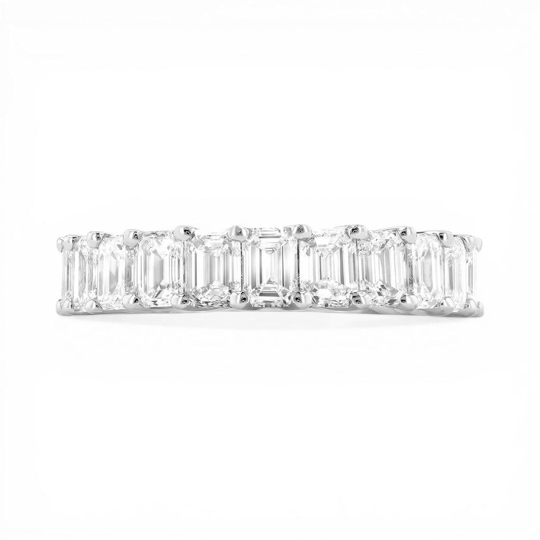 5.50 ctw Emerald Cut Diamond Eternity Band Platinum Ring: A symphony of light and color, this stunning Duchess Emerald Cut ring featuring White Diamond embodies the pinnacle of luxury. Expertly mounted in an Eternity Band setting, the ring is crafted in 6.0
