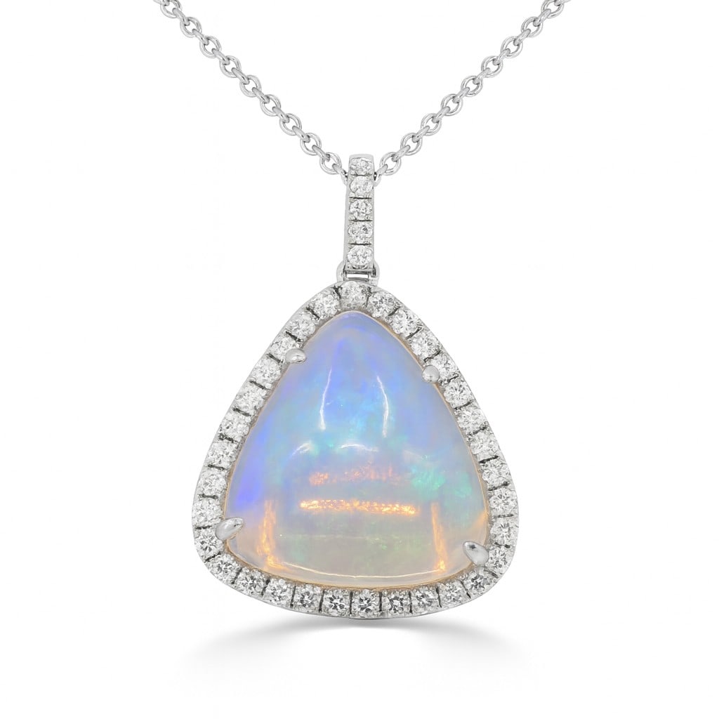 9.19ct Opal and 0.47ctw Diamond 14K White Gold Pendant: Captured in a moment of brilliance, this stunning Halo pendant featuring Opal, White Diamond speaks to the connoisseur. Expertly mounted in a Halo setting, the pendant is crafted in 3.34 grams of soli