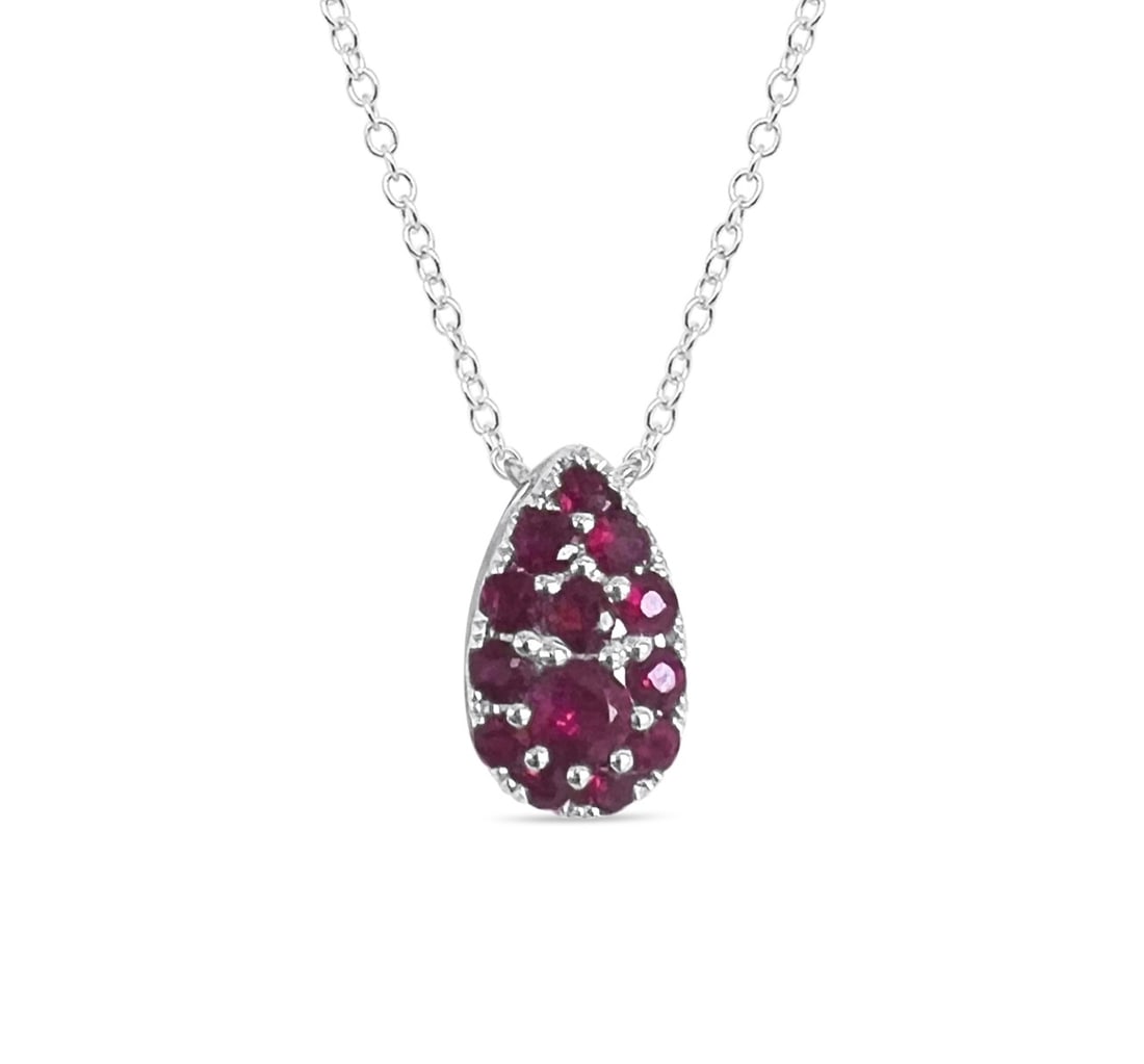 0.90ctw Ruby Pearshape Link 14K White Gold Pendant: Epitomizing grandeur, this elegant Pearshape Link pendant featuring Ruby stands as a beacon of refined taste. A detailed Cluster gallery secures the stones, rendered in 0.66 g of lustrous 14K White Go