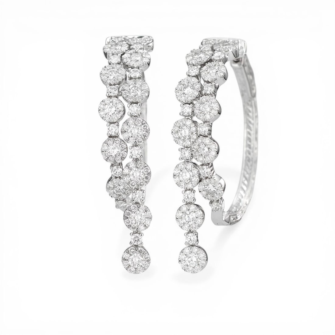 3.14 ctw Diamond Fiori Waterfall Hoop Cluster 18K White Gold Earrings: Defining modern elegance, this stunning Waterfall Hoop Cluster pair of earrings featuring White Diamond captures the essence of style. Expertly mounted in a Cluster setting, the earrings are crafted i