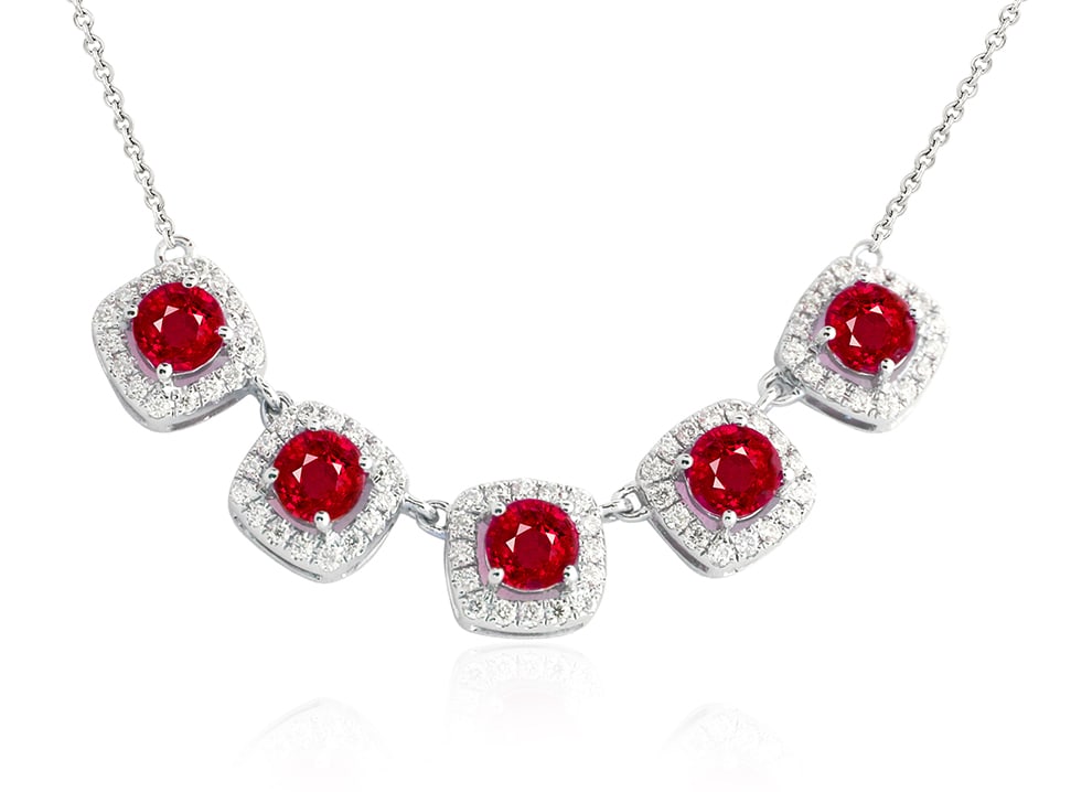 1.50ct Ruby and 0.38ctw Diamond 14K White Gold Necklace: An exquisite masterpiece of haute joaillerie, this breathtaking Mini Halo necklace featuring Ruby, White Diamond is a true treasure. Showcasing the gems in a Halo arrangement, the necklace consists of