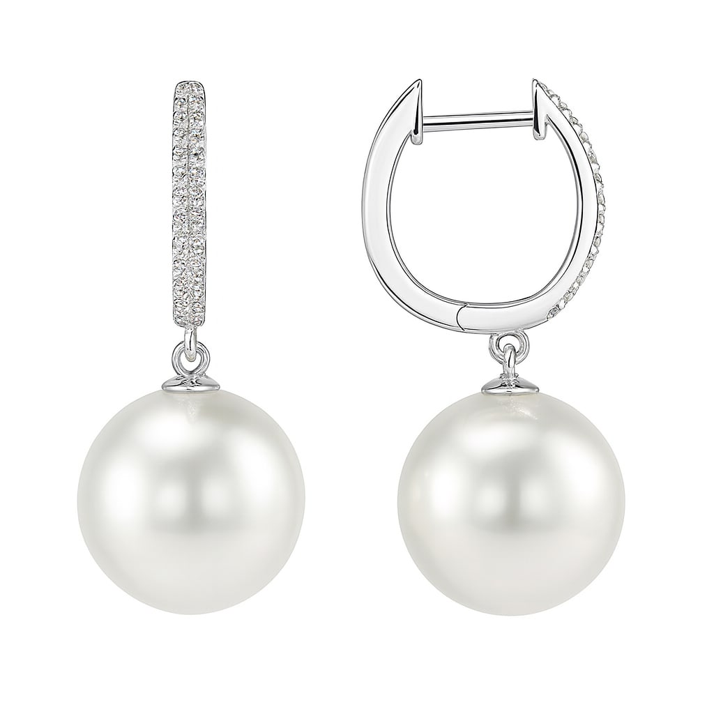 14k White Gold Earrings with South Sea Pearls and Diamonds: In a display of refined elegance, these exquisite earrings feature lustrous South Sea Pearls, complemented by shimmering Diamonds. The Diamonds, with a total carat weight of 0.08, are round cut and ex