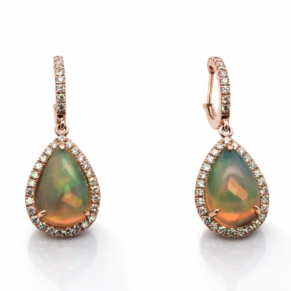 3.37ct Opal and 0.62ctw Diamond 14K Rose Gold Earrings: A symphony of light and color, this breathtaking Halo pair of earrings featuring Opal, White Diamond embodies the pinnacle of luxury. Expertly mounted in a Halo setting, the earrings are crafted in 4.