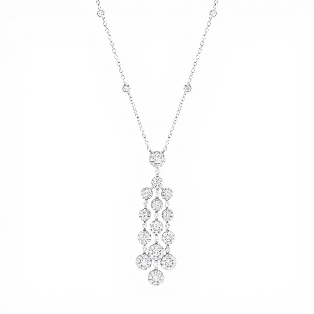 2.37 ctw Fiori Waterfall Cluster Diamond 18K White Gold Pendant: Epitomizing grandeur, this breathtaking Fiori Waterfall Cluster pendant necklace featuring White Diamonds stands as a beacon of refined taste. A detailed Cluster gallery secures the stones, rendered i