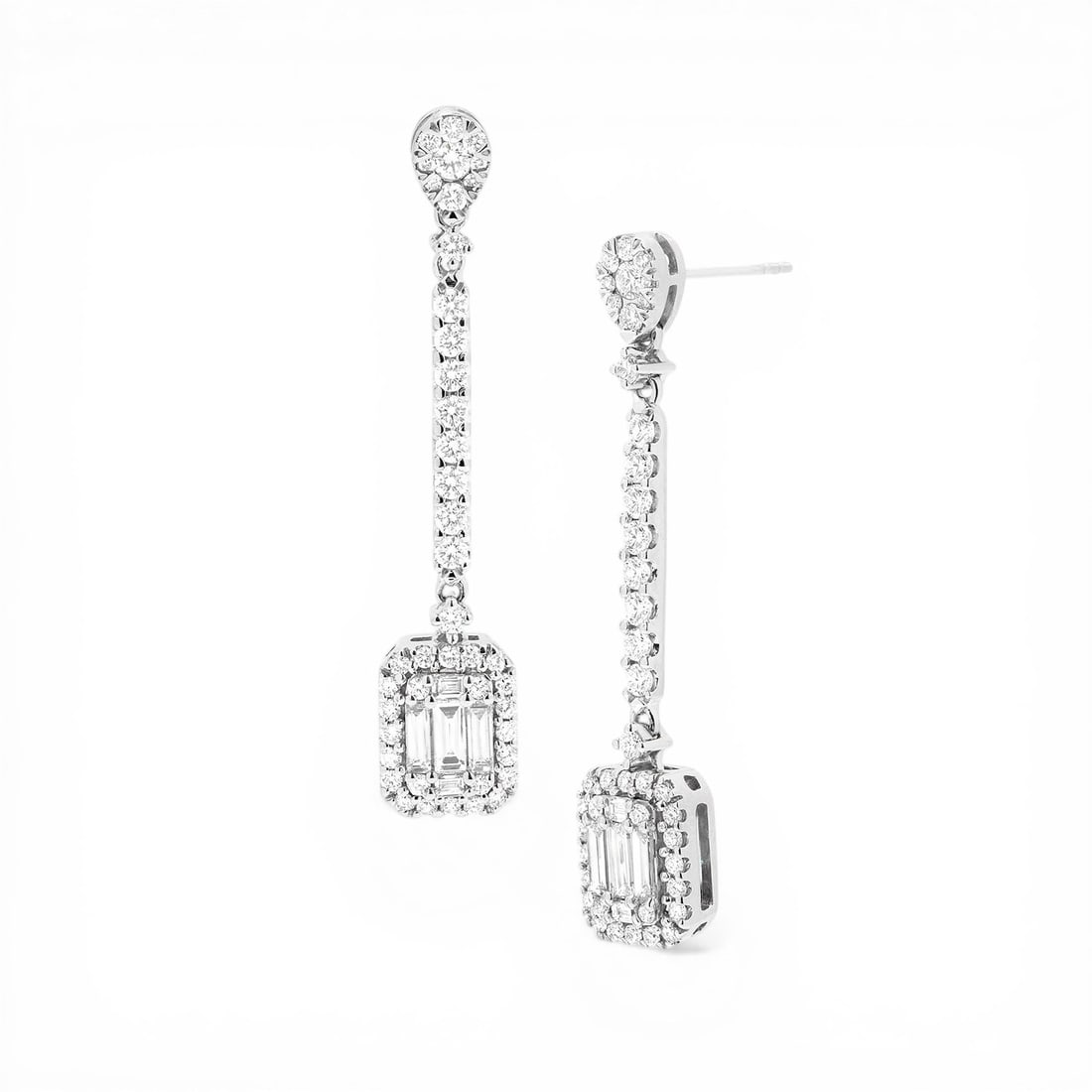 1.33 ctw Baguette and Round Diamond 18K White Gold Drop Earrings: Exuding opulence and grace, this breathtaking Swinging Baguette Drop Cluster pair of earrings featuring White Diamond is crafted for the distinguished. A detailed Cluster/Halo gallery secures the ston
