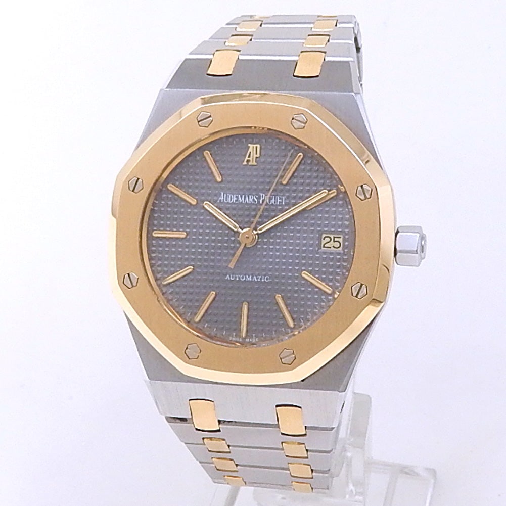 Audemars Piguet Royal Oak 14790SA.OO.0789SA.01 Two-Tone Gold & Steel Grey Dial: The Audemars Piguet Royal Oak 14790SA.OO.0789SA.01 is an exquisite representation of G?rald Genta's legendary design, blending architectural strength with luxurious finish. The 36mm case is masterfull